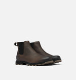 Load image into Gallery viewer, Front right view of a pair of matte brown leather ankle boots. Has no laces.
