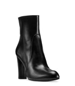 Load image into Gallery viewer, Front view of black glossy leather boot on white background. 

