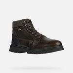 Load image into Gallery viewer, Front right view of brown winter ankle boot. Made of leather and suede, with brown laces
