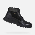 Load image into Gallery viewer, Side view of black leather winter boot on white background. Has laces and is glossy.
