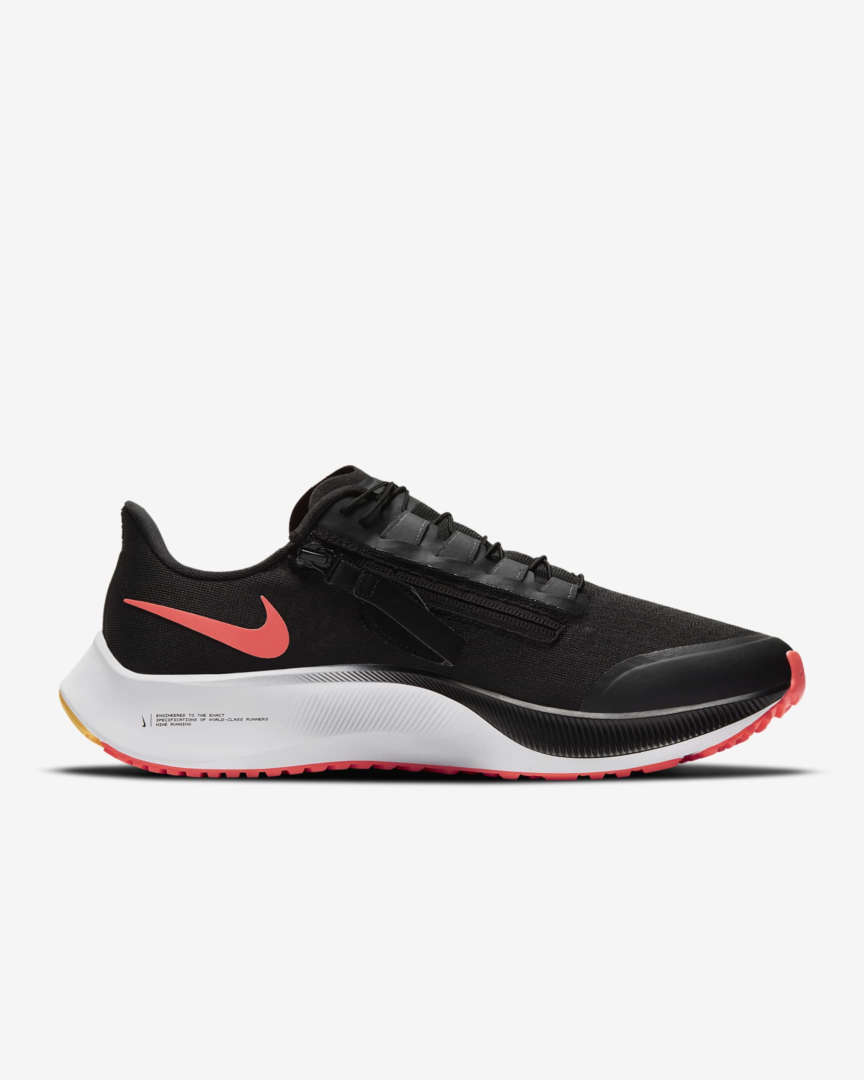 Side view of black Nike running shoe. Has black laces, white midsole and an inverted orange Nike logo. 