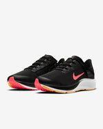 Load image into Gallery viewer, Front view of a pair of black Nike running shoe. Has red Nike logo, white midsole and black laces. 
