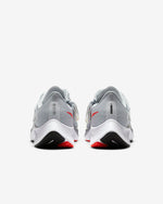 Load image into Gallery viewer, Rear view of grey Nike running shoes. Has white midsole and two tone red and black sole. 
