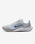 Load image into Gallery viewer, Side view of grey Nike running shoe. Has white midsole with inscription Air Zoom on the sides. Also has white laces and blue Nike logo.
