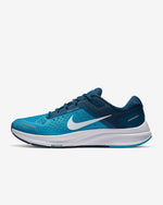 Load image into Gallery viewer, Side view of blue two tone running shoe. Has a white Nike logo and white midsole. 
